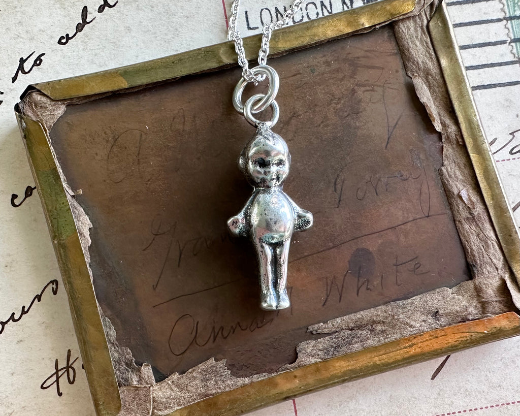 kewpie doll necklace