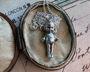 creepy doll pendant