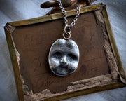 doll face pendant