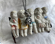 small doll head pendant