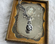 frozen charlotte doll head jewelry
