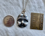 frozen charlotte pendant