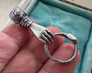 Victorian hand holding ouroboros necklace pendant - figural right hand jewelry