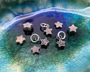 tiny bronze star fossil pendant