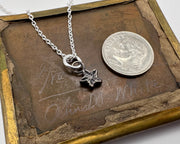 tiny bronze star pendant