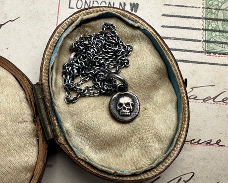 tiny skull pendant