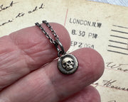 tiny bronze skull