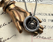skull ouroboros pendant