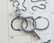 ouroboros watch key pendant