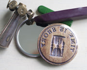 hourglass pocket mirror