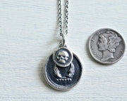 skull and wings pendant
