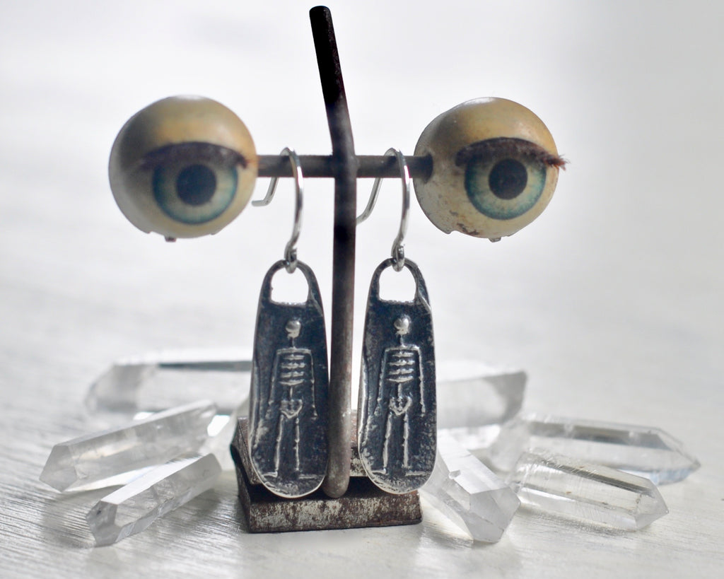 skeketon earrings