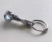 hand holding ouroboros necklace