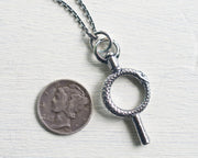 ouroboros watch key pendant