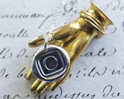 ouroboros wax seal necklace