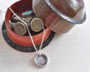 clasped hands wax seal necklace