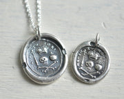 skull and crossbones memento mori wax seal necklace