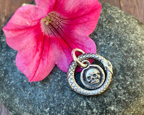 ouroboros snake and skull charm