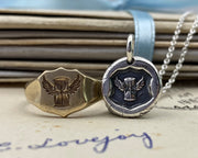 winged hourglass wax seal necklace