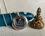 skull and bones wax seal necklace