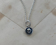 tiny skull pendant