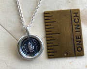 heart in hand pendant