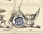 hourglass and scythe necklace