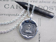 fist and flowers wax seal pendant