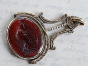 woman leaning on anchor wax seal jewelry