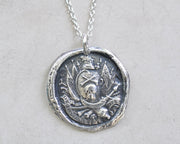 skull and crossbones wax seal pendant