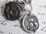 skull and bones wax seal necklace