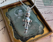creepy doll necklace