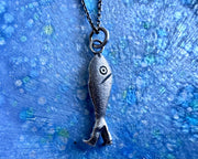 fish with legs necklace pendant - historic fish out of water jewelry