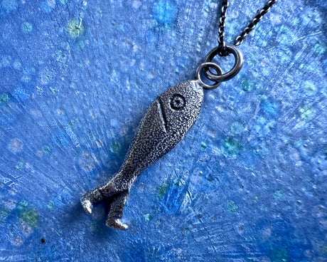fish with legs necklace pendant - historic fish out of water jewelry