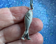 fish with legs necklace pendant - historic fish out of water jewelry