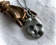 doll head necklace