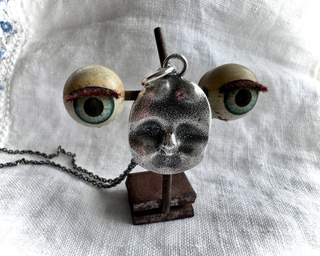 antique doll face necklace
