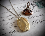 devil and cupid wax seal necklace - in golden bronze - LE DIABLE EMPORTE