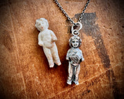 Frozen Charlotte doll necklace pendant - holding a heart - doll jewelry
