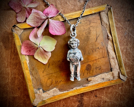 Frozen Charlotte doll necklace pendant - holding a heart - doll jewelry