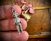 Frozen Charlotte doll necklace pendant - holding a heart - doll jewelry