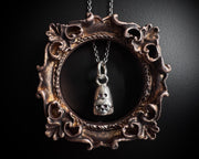 Desdemona the ghost necklace charm - ghost holding a skull heart