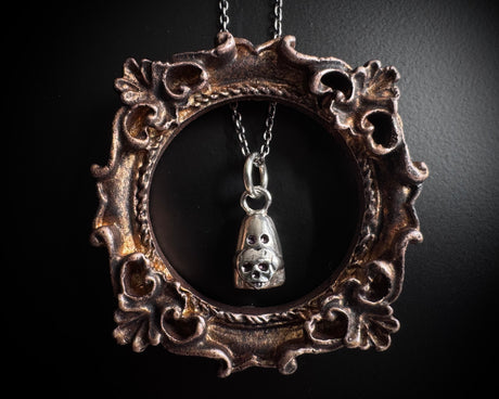Desdemona the ghost necklace charm - ghost holding a skull heart