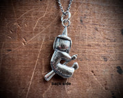 witch on her broom pendant - Halloween jewelry