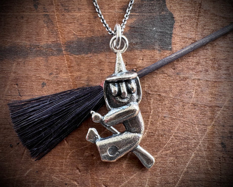 witch on her broom pendant - Halloween jewelry