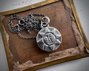 sun headstone necklace