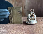 a winged cherub delivering a heart fob seal - L'AMITIE - antique wax seal