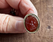 a winged cherub delivering a heart fob seal - L'AMITIE - antique wax seal