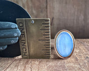 woman leaning on an anchor wax seal fob - antique wax seal