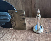 woman leaning on an anchor wax seal fob - antique wax seal